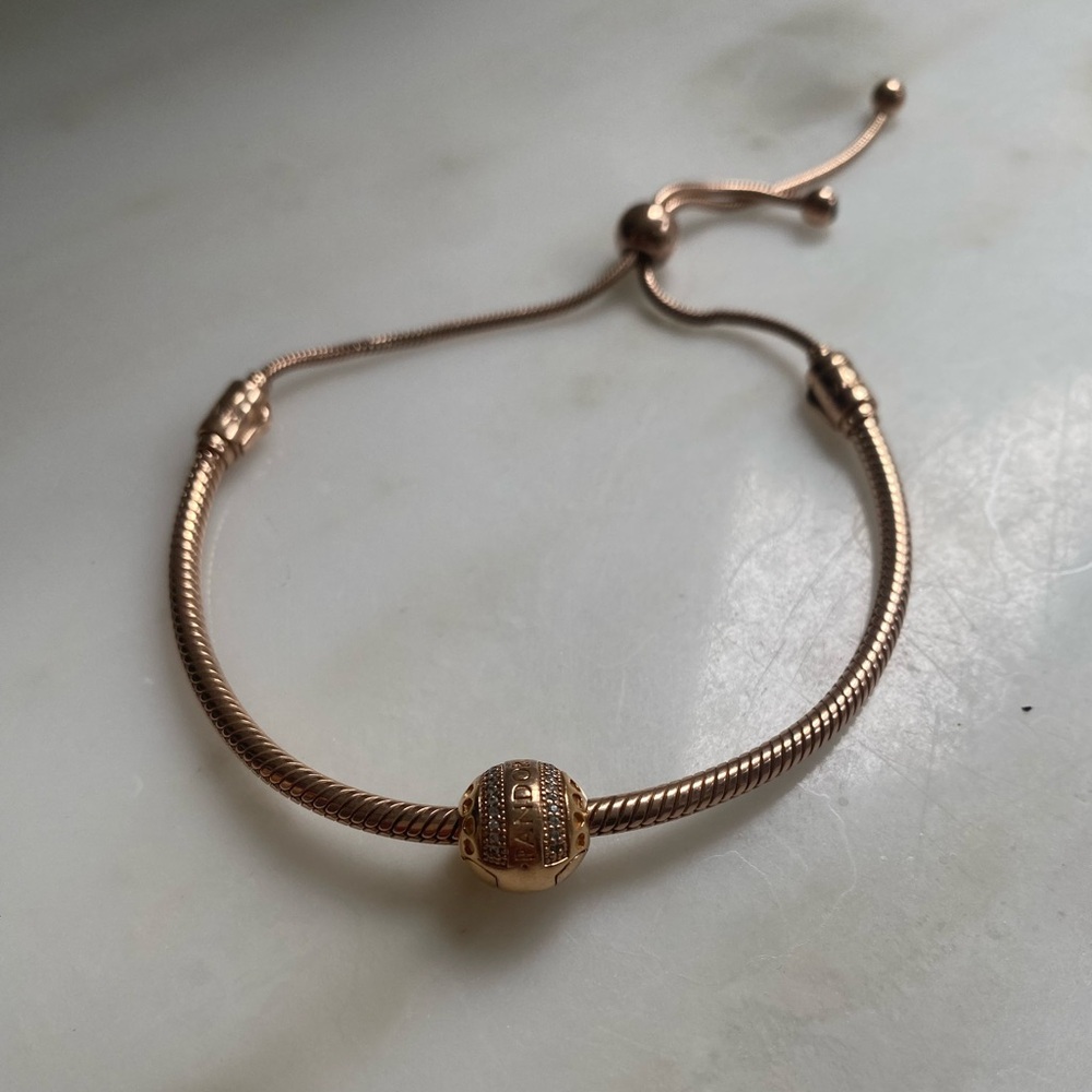 Pandora rose gold plated OS adjustable bracelet with charm